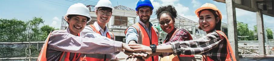 contractors huddled together on a construction site